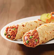 Marinated soya chunks wrapped in a soft tortilla with fresh veggies and sauce.